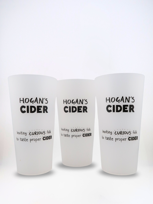 Three Hogan’s Cider reusable EcoCups – pint-sized cups printed with our ‘Inviting Curious Folk’ design.